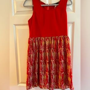 Dress: Red sleeveless top, Giraffe print lower skirt